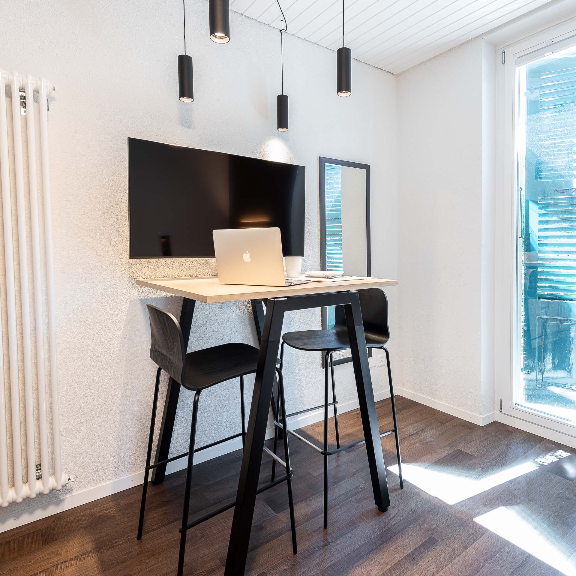 Bright studio apartment with a high table